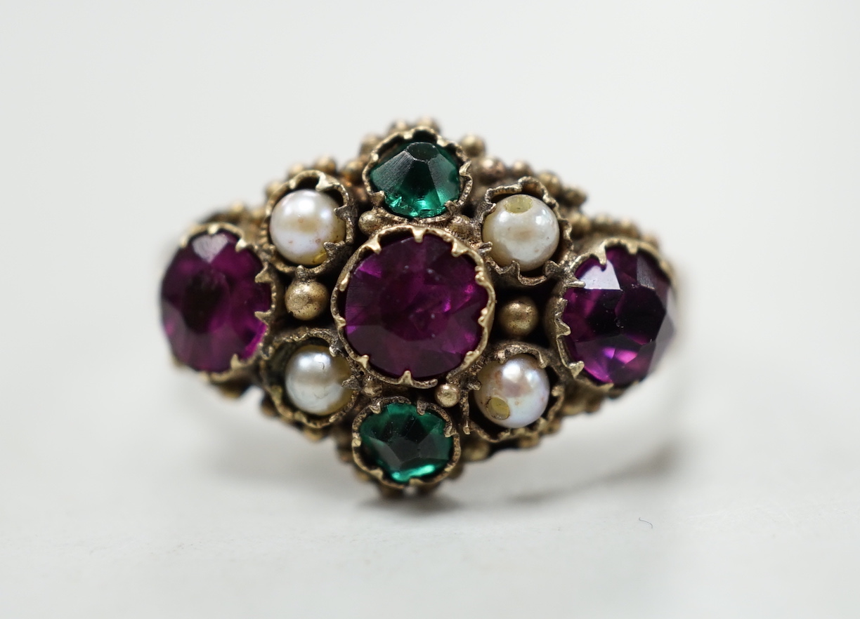 An early 20th century 9ct and coloured paste set ring, in the Suffragette colours, size N, gross weight 2.3 grams.